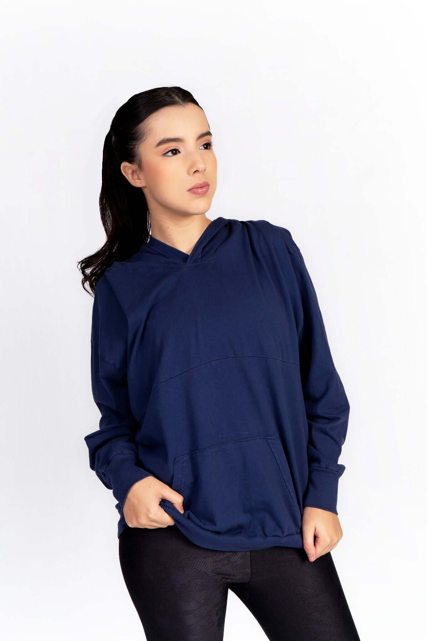 Relax Hoodie in navy blue on model, featuring an oversized fit, hood, and kangaroo pocket.
