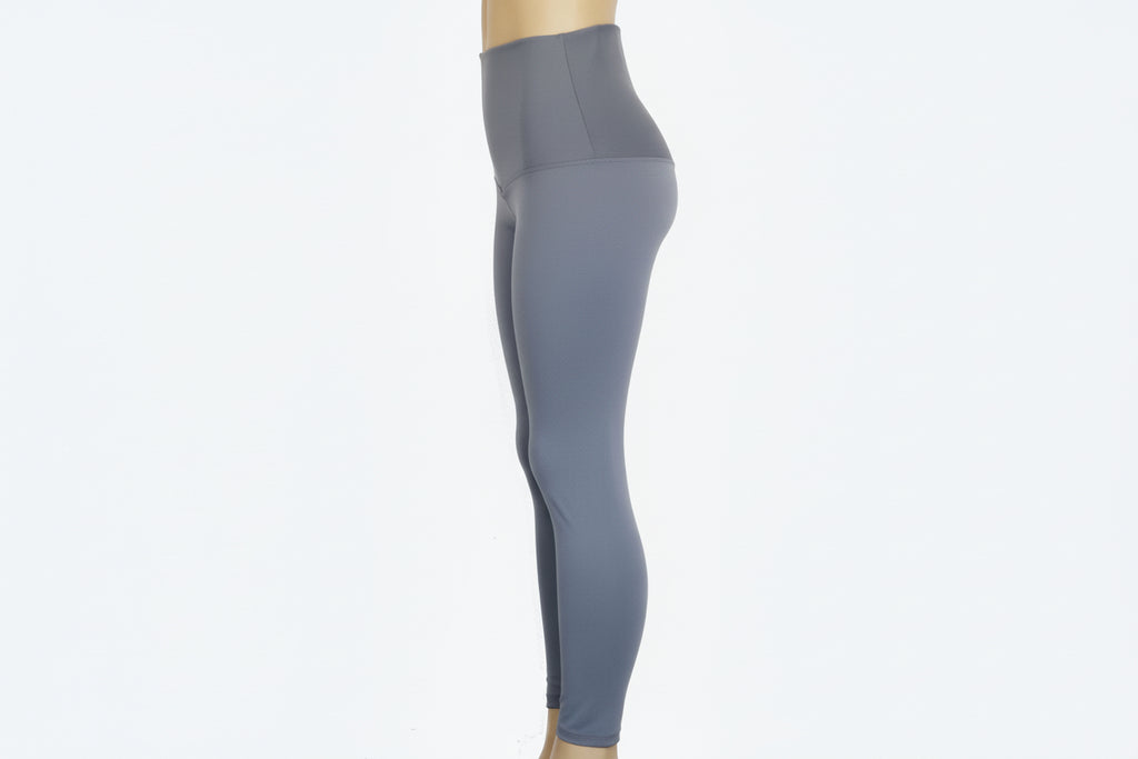Gray leggings on a mannequin against a white background