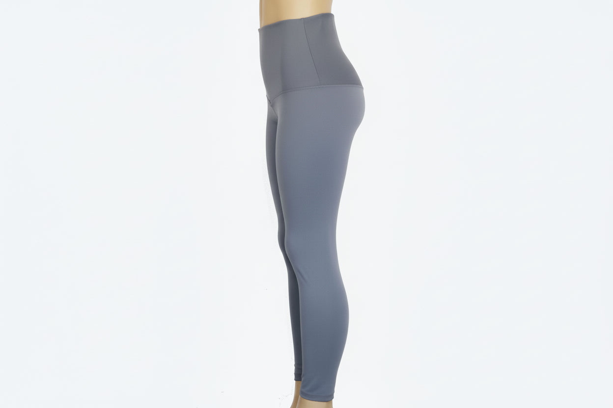 Gray leggings on a mannequin against a white background